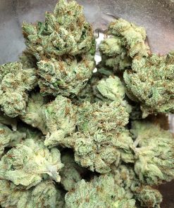 Close-up of Skywalker OG flower revealing wiry orange pistils and heavy frosty trichome coating