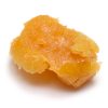 Premium cannabis budder concentrate with a waxy frosting-like texture in a small container, available in multiple strains