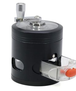 Portable herb grinder in pink showing space-saving foldable handle