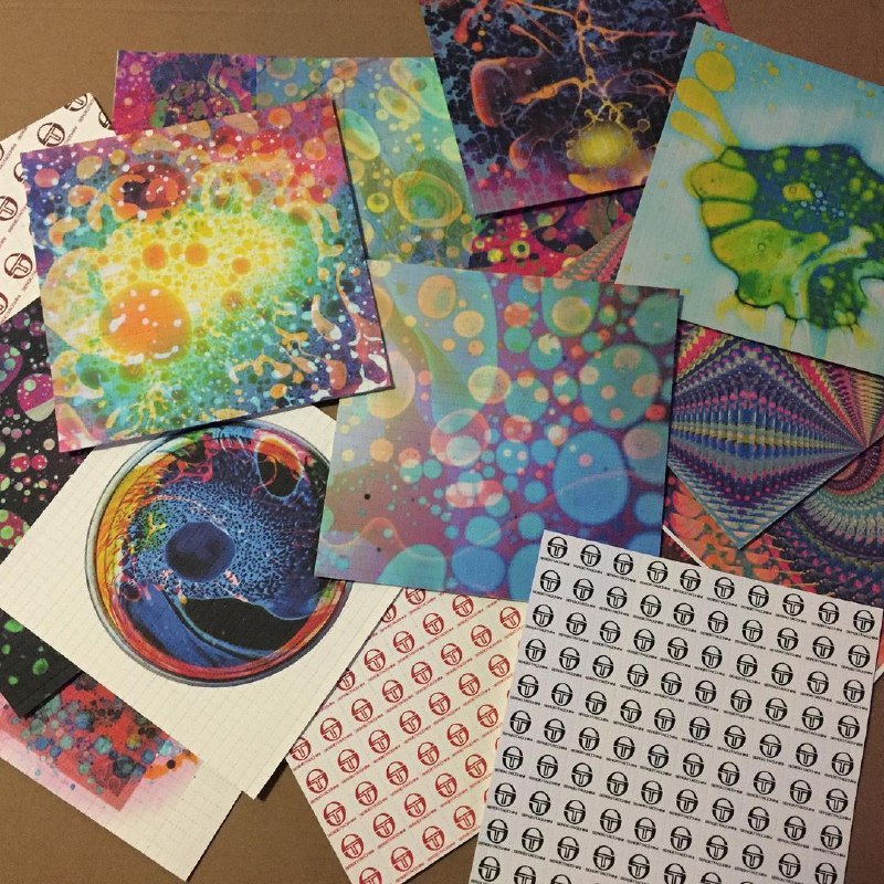 IMG_8849.jpg Blue LSD blotter paper with vibrant psychedelic art design