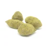 Close-up of cannabis moon rocks showing thick kief coating over a concentrate-dipped nugget