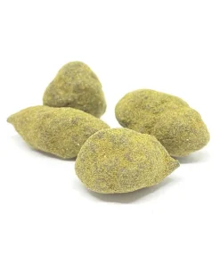 Close-up of cannabis moon rocks showing thick kief coating over a concentrate-dipped nugget