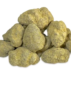 Premium marijuana moon rocks with dense golden kief layer and visible hash oil concentrate coating