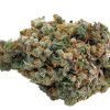 Trainwreck sativa cannabis flower buds with dense frosty trichomes, orange pistils, and vibrant green coloring