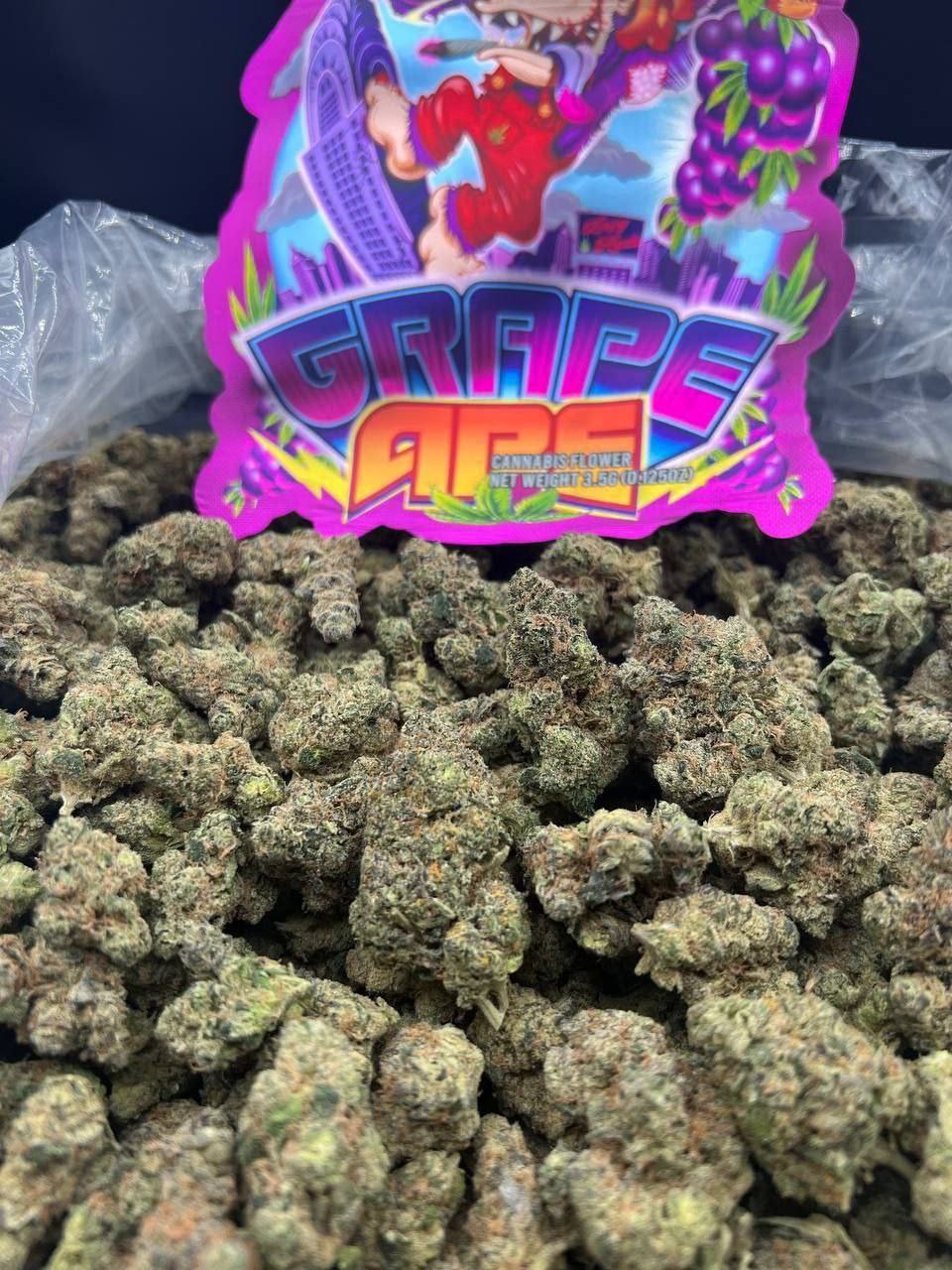 Grape Ape Strain – Premium Indica Flower Grape Ape strain dense purple and green indica buds with copper pistils and heavy trichome coverage