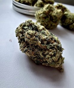 Premium Sour Diesel cannabis strain buds, pungent aroma, high-THC hemp product.