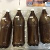 Bottle of traditionally brewed ayahuasca tea made with Banisteriopsis caapi and Chacruna, available for sale online