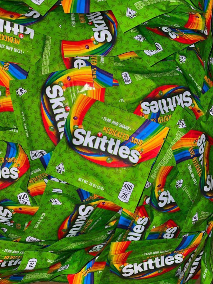 THC Distillate Sour Candy Close-Up Close-up of individual THC Skittles candy pieces showing vibrant sour fruit colors