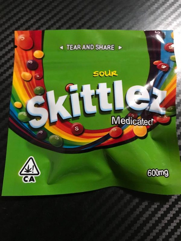 THC Skittles edibles pack showing colorful sour fruit candies with 600mg THC distillate coating