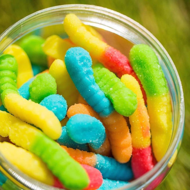 THC gummy worms edibles in a resealable pack showing 10 sour worm pieces at 25mg THC each