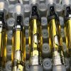 Heavy Hitters cartridge with True Ceramic hardware and Cold-Filtered distillate oil, available at Florida Gas Packs
