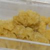White Fire OG Wax concentrate 84% THC golden wax in glass container from Florida Gas Packs