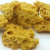 Golden Jack Herer wax concentrate in glass jar, terpene-rich cannabis extract, premium THC concentrate