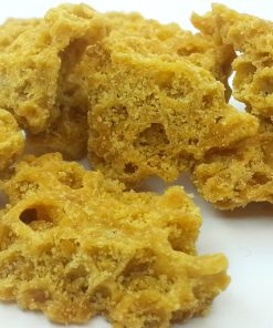 Golden Jack Herer wax concentrate in glass jar, terpene-rich cannabis extract, premium THC concentrate